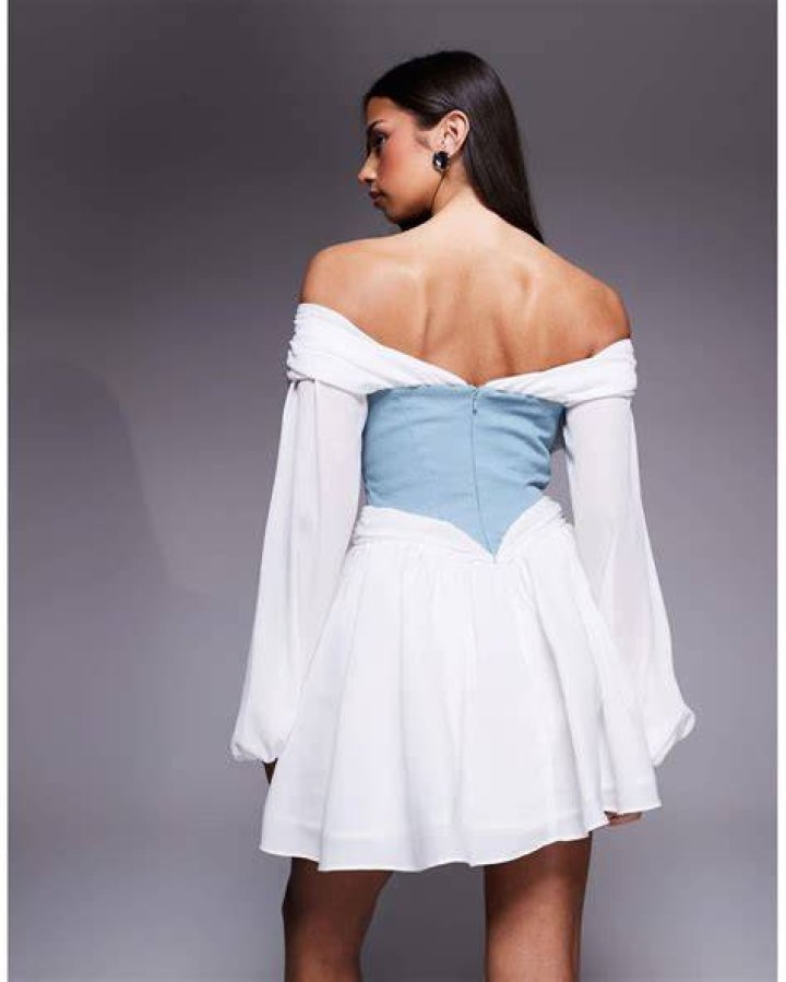 Dress, Shoulder, Style, Penguin, Waist, Fashion model, Blond, One-piece garment, Design, Fashion design, 